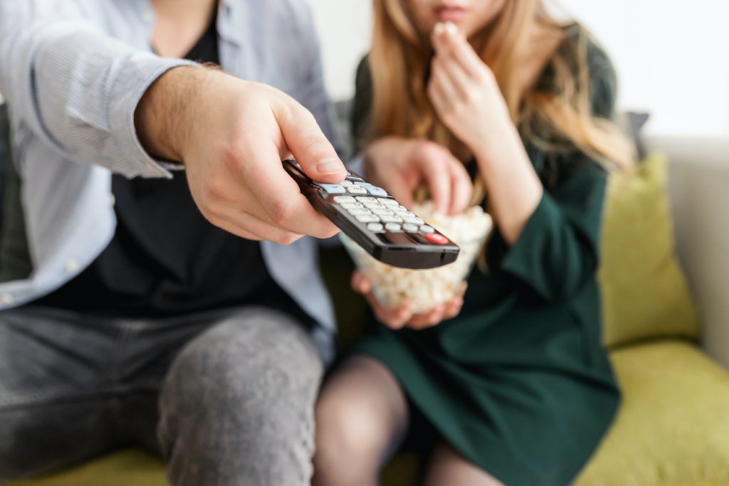 Man Holding Remote Control 1040160