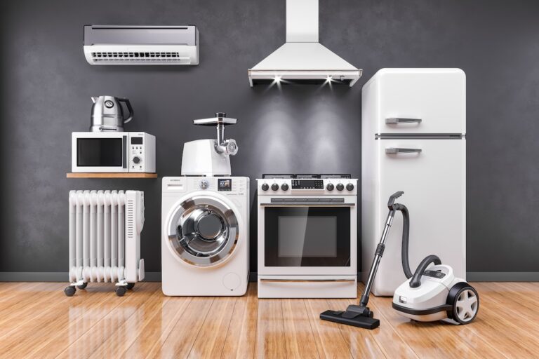 Set Of Home Kitchen Appliances In The Room On The Wall Background